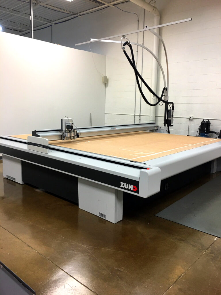 Digital cutting table used to cut packaging prototypes straight from the dieline file